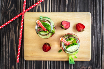 Detox water infused with fruits. Summer water fruit on rustic background