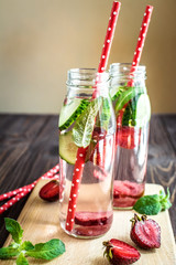 Detox water infused with fruits. Summer water fruit on rustic background