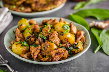 Potato pancakes, fried chicken with potatoes