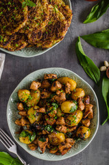 Potato pancakes, fried chicken with potatoes