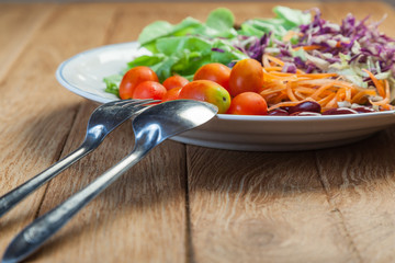 Healthy concept with mixed fruits and vegetables on wooden background