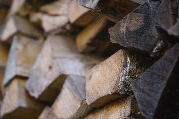 natural firewood stack rustic background closeup