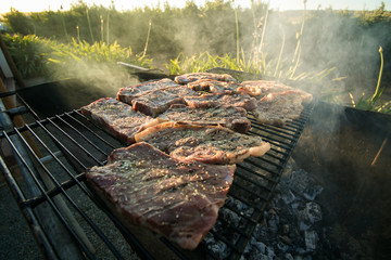 Close up wide angle view of meat on the braai / barbeque as a traditional meal in south africa