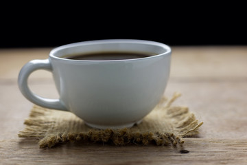 Cup of coffee on wood