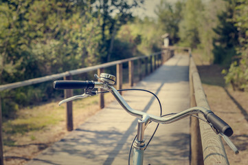 Bike path and bicycle handlebar close-up. Bicycle friendly city.