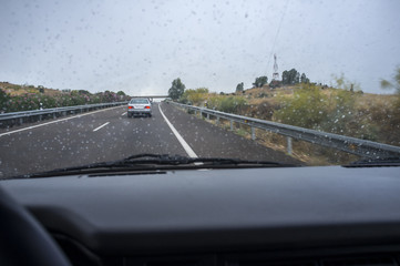 Fototapeta na wymiar Driving on a highway in the rain