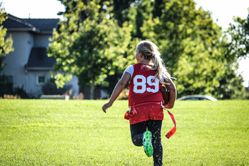 Girl Running With Football