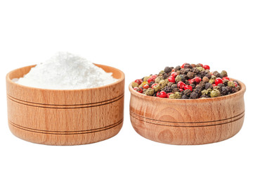 different dry peppers and sea salt in natural wooden pot isolated on white background, close up