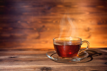 cup of tea on dark wooden background, close up