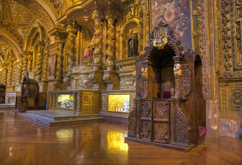 Confessional booths inside the Compania church in downtown Quito, Ecuador.