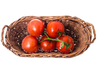 Tomatoes in basket on white