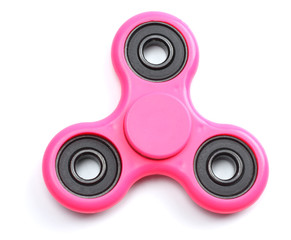 Pink fidget finger spinner toy isolated on white background