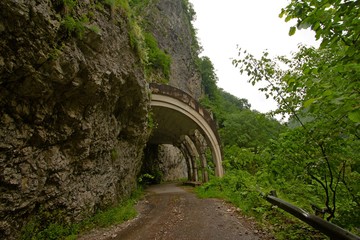 Fototapeta na wymiar Old abandoned mountain road