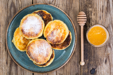 Breakfast. Russian traditional cottage cheese pancakes in the pl