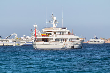 Fototapeta na wymiar Luxury yachts at Porto Cervo bay at Sardinia Island, Italy