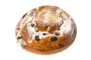 Breakfast. Fresh sweet bun with powdered sugar and raisins on wh