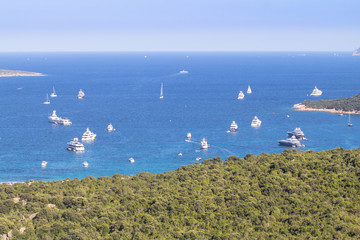 Luxury yachts at Porto Massimo bay at Sardinia Island, Italy