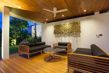 Interior and exterior design of pool villa which features living area, greenery garden, pavilion 