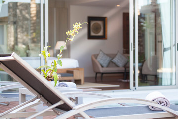 uxury Interior design in bedroom of pool villa with cozy king bed. Bedroom with high raised ceiling 