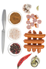 Small smoked sausages on white background.