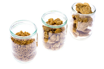 Different types of textured soy protein (meat) on white backgrou