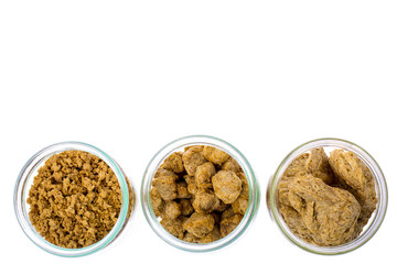 Different types of textured soy protein (meat) on white backgrou