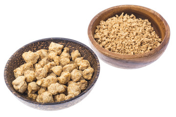 Set of wooden bowls with soy meat pieces.