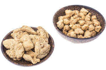 Set of wooden bowls with soy meat pieces.