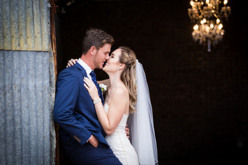 Beautiful bride and her groom on their wedding day looking happy and in love at the start of their marriage