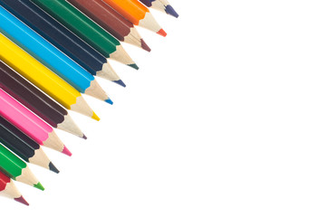 Line of colored pencils on white background