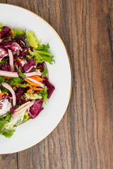 Mix salads with pomegranate and ham