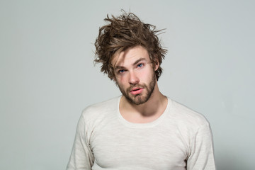 Obraz premium sleepy man with long uncombed hair wake up in morning