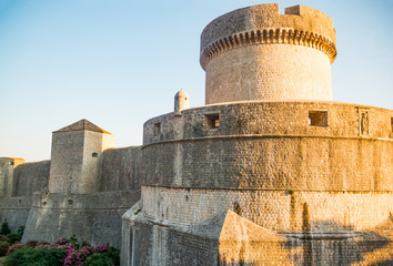 Fototapeta premium Minceta Tower at sanset lights and Dubrovnik medieval old town city walls in Croatia