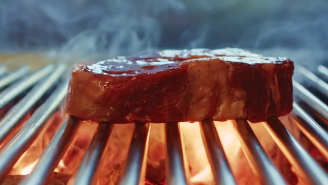 Cooking steak from marbled beef on the grill