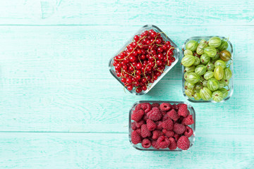 Summer berries on a wooden background