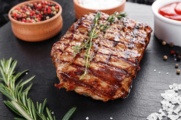 Steak cooked on a blackboard