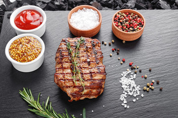 Steak cooked on a blackboard