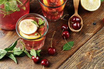 cups with a cherry drink