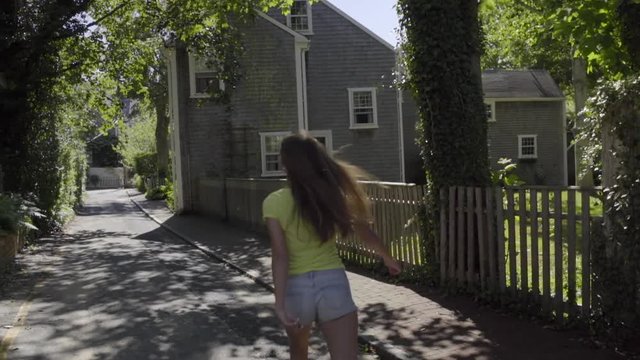 Teen Girl Dances Down The Middle Of A Neighborhood Road (Slow Motion)