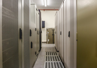 Switchgear room with cabinets with network hardware