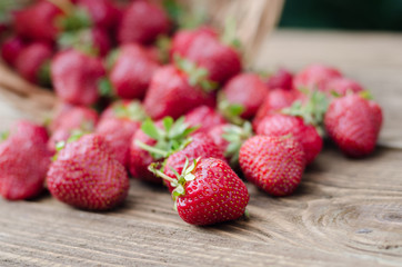 Strawberries ripe red on wooden table