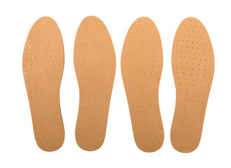 Brown insoles for shoes on a white background