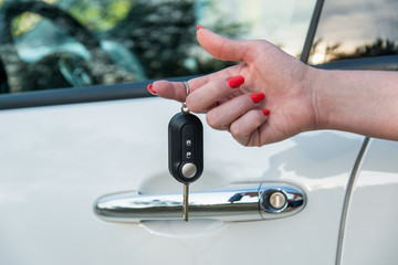 Woman's hand with car key