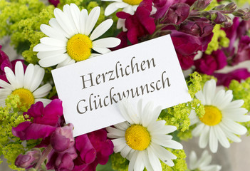 Congratulations / Greeting card with snapdragons, daisies and German text: Congratulations 
