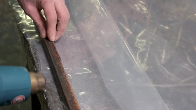 Wood and polythene. Heat gun in action. How to construct a greenhouse.