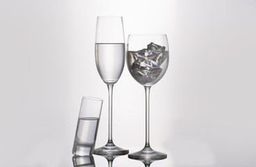 Isolated glass  and cup of water