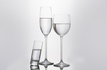 Isolated glass  and cup of water