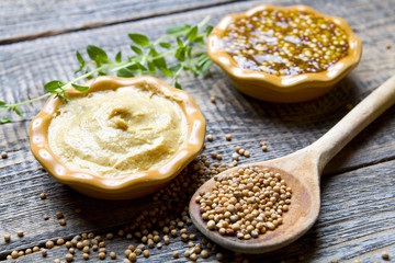 Mustard on wood with mustard seeds