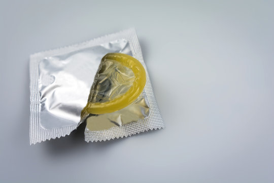 Condom close-up. Contraceptive protection from pregnancy, AIDS.
