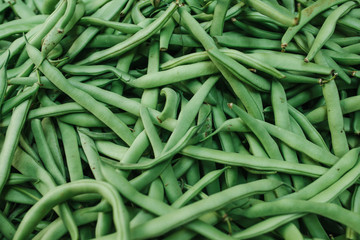 Green beans background. Natural local products on the farm market. Harvesting. Seasonal products. Food. Vegetables.